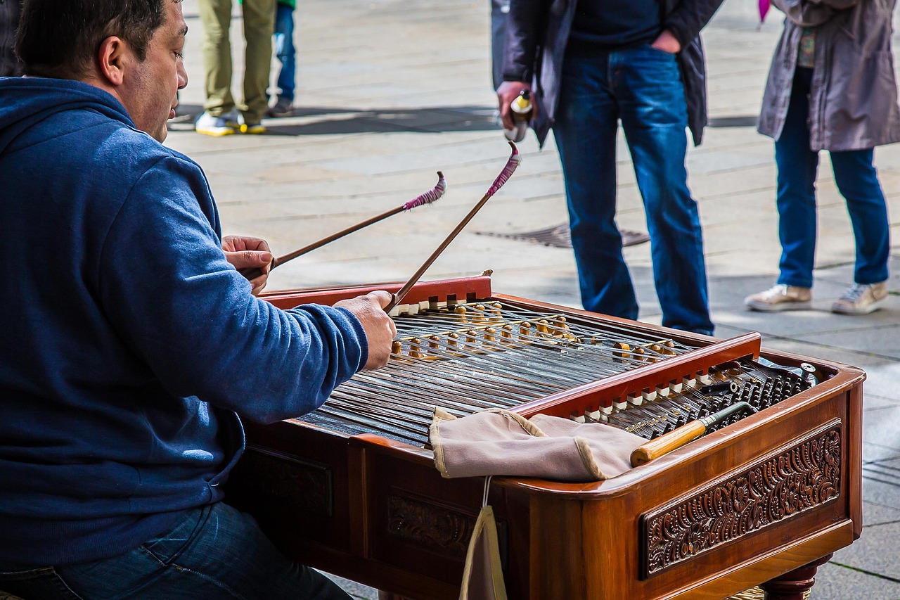 Musician playing yangqin hammered dulcimer traditional Chinese string instrument
